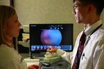 Michael Chiang reviews images of the eyes of premature babies who were sent to him via the telemedicine program at OHSU for ROP monitoring and diagnosis.