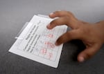 A student named Hector taps his finger on his stamp sheet during a small-group tutoring session at Metzger Elementary School in Tigard on Aug. 7, 2025. As a dual-language school, Metzger has students learning and reading Spanish as well as English.