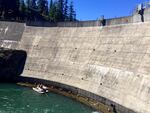 Biologists used a cataraft and a tangle net to catch bull trout at the base of Clear Creek Dam. They're trying to help the fish around the dam so that they can get to better habitat.