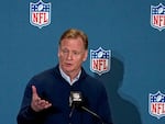 NFL Commissioner Roger Goodell speaks to the media on March 28 in Phoenix. The attorneys general of New York and California announced Thursday that they are investigating allegations of workplace discrimination by the pro football league.