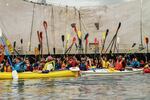 Kayakers on the Willamette River raised their paddles in protest of Shell's Arctic oil drilling efforts, July 25, 2015, in Portland.