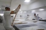 Bakers roll and stretch dough into paper-thin sheets for balkava at the factory of Celebiogullari.