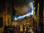 Firefighters work after building collapsed early Sunday in Marseille, southern France.