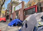 Tents along Southwest 13th Avenue in Portland, April 4, 2022. In a survey commissioned by OPB, homelessness ranked as the top concern among potential Oregon voters.