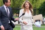 FILE - Lindsey Halligan, special assistant to the president, speaks with a reporter outside of the White House, Wednesday, Aug. 20, 2025, in Washington.