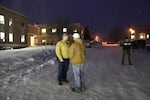 A Pacific Patriots Network member meets with Harney County Sheriff Dave Ward, left, outside the county courthouse.