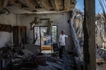 Najib Ayyad checks his apartment in Nabatiyeh, Lebanon, which was heavily damaged and likely to be demolished. The apartment overlooks Beaufort Castle, a national symbol of deep personal meaning for him, now occupied by Israeli forces.