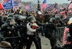 Trump supporters clash with police and security forces as they storm the U.S. Capitol on Jan. 6, 2021.