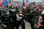 Trump supporters clash with police and security forces as they storm the U.S. Capitol on Jan. 6, 2021.