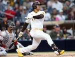 Juan Soto #22 of the San Diego Padres connects for a two-run homerun during the first inning of a game against the Arizona Diamondbacks at Petco Park on April 03, 2023 in San Diego, California.