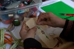 Palestinian Hanan Zarura embroiders on a canvas a Palestinian pattern in her office at Beit Atfal Assumoud, in Shatila refugee camp, in Beirut, on Dec. 2, 2024.