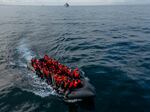 In this drone view, an inflatable dinghy carrying migrants makes its way across the English Channel to Britain, on May 4.