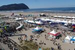 A beach party awaits Hood To Coast runners after they finish the race. This year's high heat means teams aren't expected to finish extremely fast.