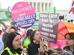 Protesters rally outside the U.S. Supreme Court on April 24, 2024, as it hears arguments on whether an Idaho abortion law conflicts with the federal Emergency Medical Treatment and Labor Act.