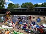 Mementos decorate a makeshift memorial to the victims of the mass shooting at Robb Elementary School in Uvalde, Texas. To protect students from active shooters and extreme weather, National Safety Shelters sells safety pods that can fit a classroom of students inside.