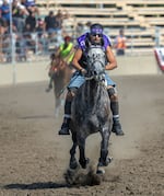 Garret Mason of the Camp Six team, barrels down the straightaway during a heat of the relay.