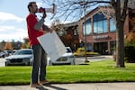 Clayton Franke leads the lunchtime picket in chants outside the Bend Bulletin office in Bend, Ore., on Oct. 28, 2025. Franke and other union members are hoping to complete their first contract with employer Carpenter Media.