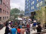 Community members gather to celebrate the opening of the Albina One housing development in Northeast Portland on Saturday, Sept. 6. It's the first step in a broader effort to restore the Albina neighborhood that was harmed by the city's pursuit of growth decades ago.