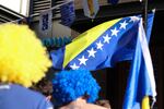 Fans wave a Bosnia and Herzegovina flag in Pioneer Square in Seattle on June 24, 2026, after a historic World Cup match win.