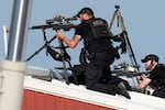 Police snipers return fire after shots were fired while Republican presidential candidate former President Donald Trump was speaking at a campaign event in Butler, Pa., on Saturday, July 13, 2024.