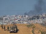Israeli army troops are seen near the Gaza Strip border, in southern Israel, Sunday, Dec. 24, 2023.