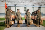 Marine recruits wait for their drill instructor as they cross the base at Marine Corps Recruit Depot, Parris Island on August 22 in Beaufort County, S.C.