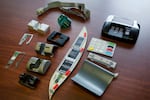 A variety of tools used to skim information from credit cards are displayed at the office of the New York Police Department's Financial Crimes Task Force. Over the years, the Justice Department has prosecuted individuals in SNAP skimming schemes, especially from Romanian crime rings.
