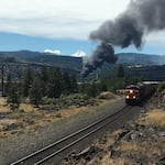 Train derailment fire as seen from Coyote Wall area on Washington state Route 14.