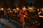 Chandler Pappas and right wing demonstrators walk near a vigil on Oct. 30 for a Black man killed by police in suburban Vancouver, Wash.