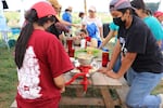 FILE - Youth at an ancestral fermentation class held by nonprofit CAPACES over the summer of 2022. CAPACES was able to quadruple programming with summer learning grants from the state that year.