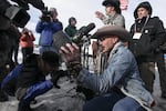 Robert "LaVoy" Finicum holds up an FBI surveillance camera the occupiers dismantled during their time at Malheur National Wildlife Refuge.