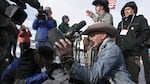 Robert "LaVoy" Finicum holds up an FBI surveillance camera the occupiers dismantled during their time at Malheur National Wildlife Refuge.