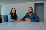 Jeremy Habelitz and Kaitlyn Morrow at their dining room table in their home in Hesperia, CA, Wednesday, September 2nd, 2026 (David Fouts for NPR)