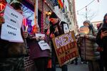 People gather outside the Stonewall Inn on Feb. 26 in New York City for a vigil for Nex Benedict, a 16-year-old who identified as nonbinary.
