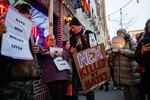 People gather outside the Stonewall Inn on Feb. 26 in New York City for a vigil for Nex Benedict, a 16-year-old who identified as nonbinary.