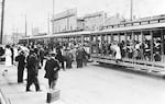 This image, circa 1905, shows an interurban electric line train going to "The Oaks" amusement park.
