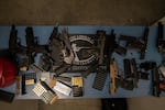 Guns are splayed out at the gun range during The Liberal Gun Club’s winter range day on Jan. 26, 2019 in Portland, Ore.