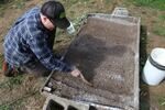 Making little seed beds with the back handle of a garden knife.