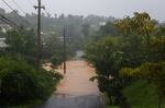 A road is flooded by the rains of Hurricane Fiona in Cayey, Puerto Rico.