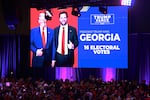 Supporters watch as Georgia is called for Donald Trump during an election night watch party at the Palm Beach Convention Center.
