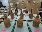 18th-century bottles that contained fruit sit inside an archaeology lab near George Washington's residence in Mount Vernon, Va., on Monday.