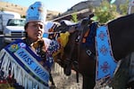 Miss Warm Springs Thyreicia Simtustus prepares her horse Sting for the horse parade to mark Kah-Nee-Ta's last weekend. 