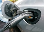 A 2022 file photo of a plug-in hybrid electric vehicle as it charges. Oregon will temporarily reopen rebate programs for people who buy or lease qualifying EVs from April 3-June 3.