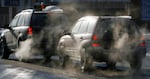 FILE - In Oregon, state officials estimate roughly 35% of the state's carbon emissions come from the transportation sector. In this Jan. 26, 2009 file photo, cars give off exhaust fumes in Montpelier, Vt.
