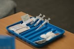 Syringes are prepared for the measles, mumps and rubella vaccine at a clinic in Lubbock, Texas, on Feb. 26, 2025.