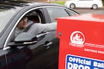 In this file photo, a voter drops his ballot in a ballot drop box in Vancouver, Wash., on Nov. 5, 2024.