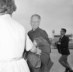 FILE - Bertha Holt, center, wife of the late Harry Holt, the Oregon farmer who helped with the adoptions of over 900 Korean-American children to families in the U.S., talks with reporters after her arrival in Seoul South Korea to attend her husband's funeral, April 30, 1964.