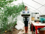 In this undated photo provided by Dusti Arab, she poses for a picture with at her edible-plant nursery and CSA in Vancouver.