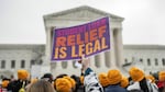 Activists and students protest in front of the Supreme Court during a rally for student debt cancellation in Washington, D.C., in February 2023.