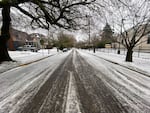 Slush covers Southeast Miller Street near St. Agatha Catholic School in the Sellwood neighborhood in Portland, Ore., Thursday, Jan. 18, 2024.